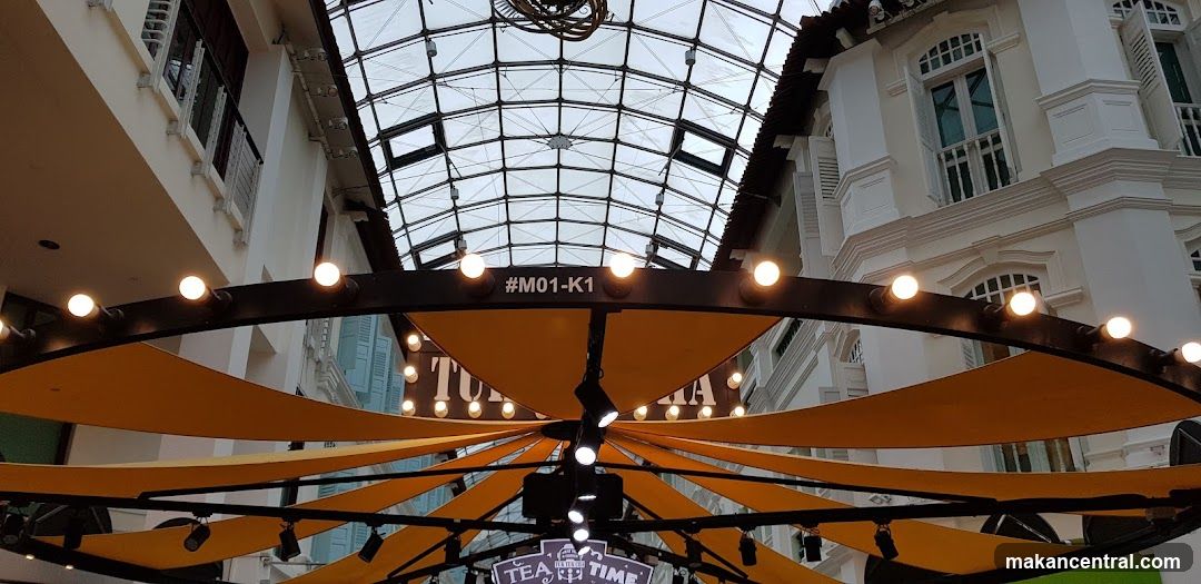 Outdoor seating area with decorative lighting and canopy