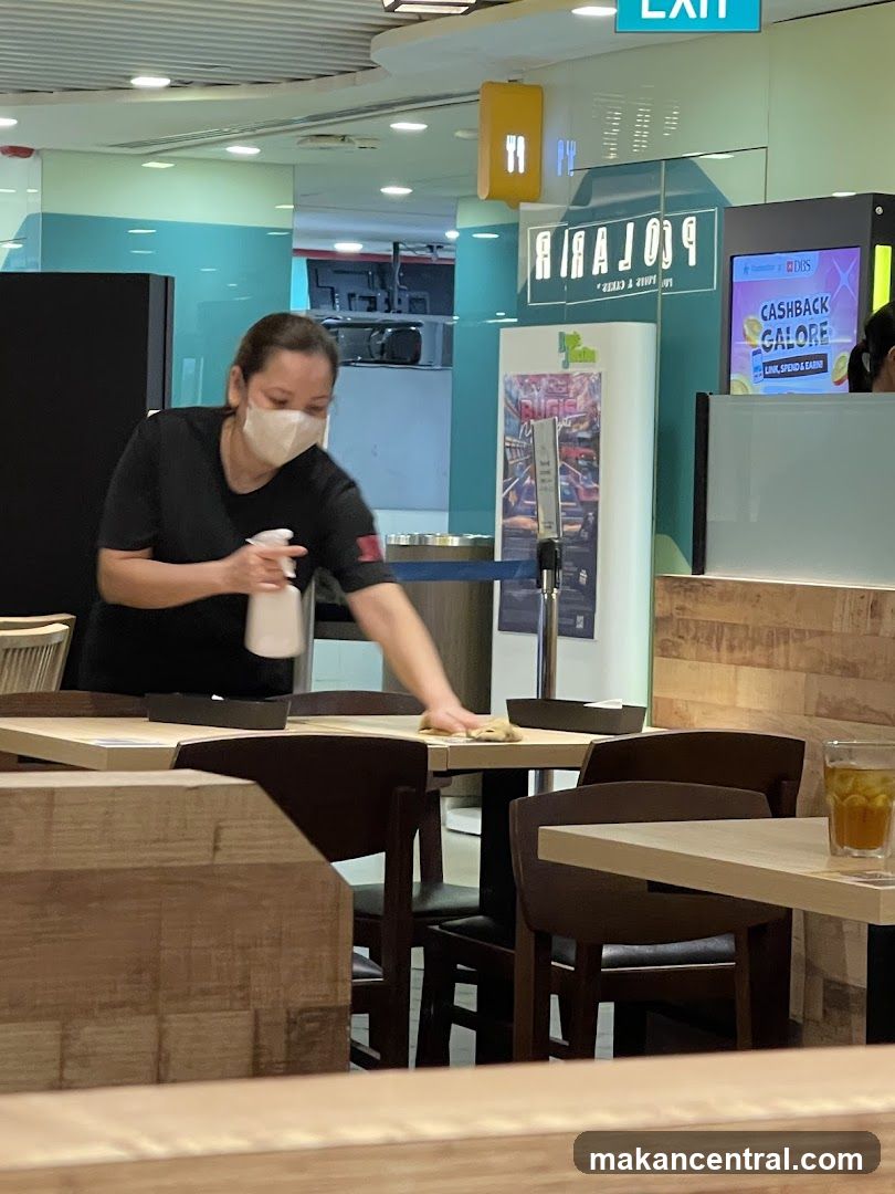 Staff cleaning tables