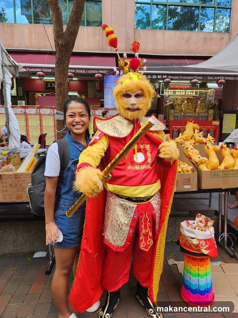 Person in Monkey King Costume with Woman