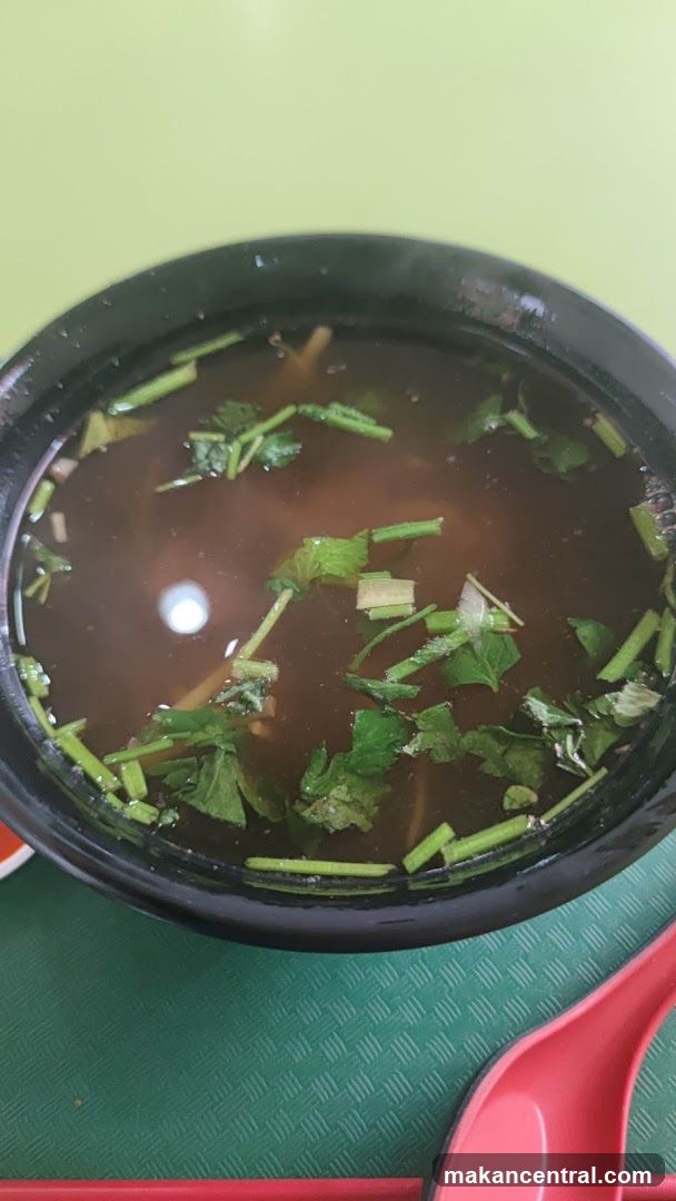Bowl of soup with herbs