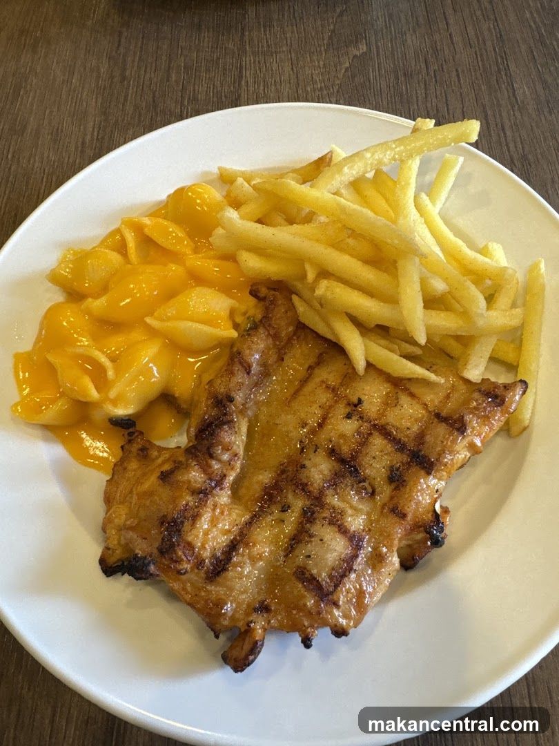 Grilled Chicken with Macaroni and Cheese and Fries
