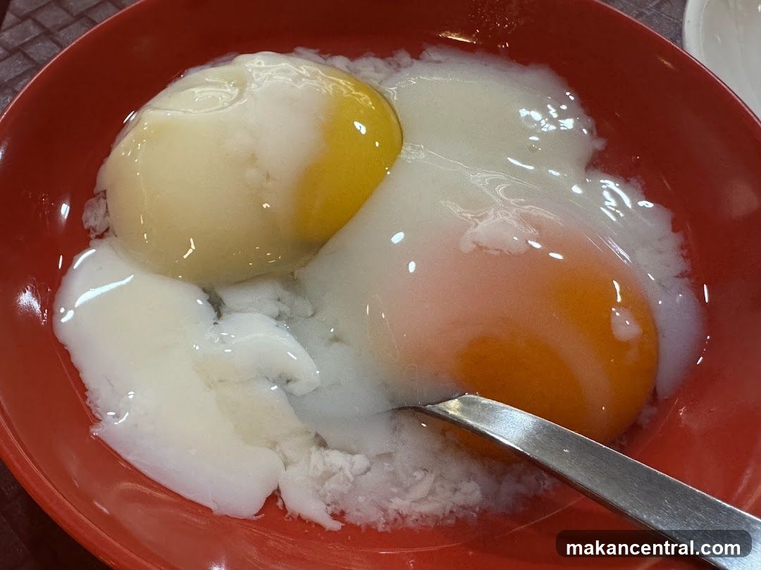 Soft-boiled eggs in a red bowl