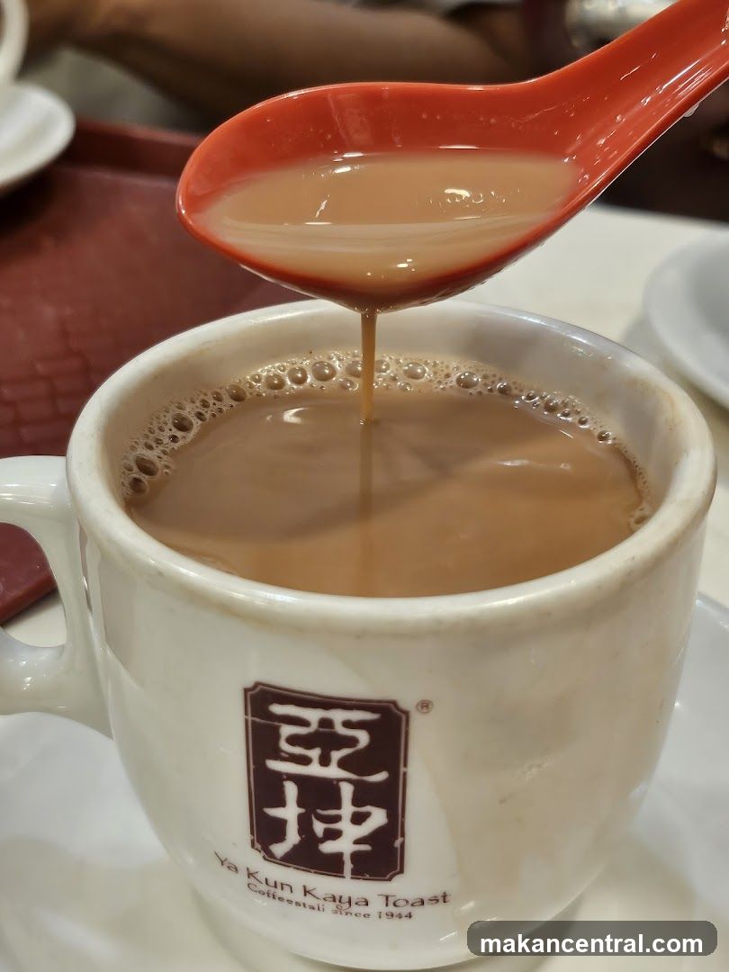 Tea being poured into a cup