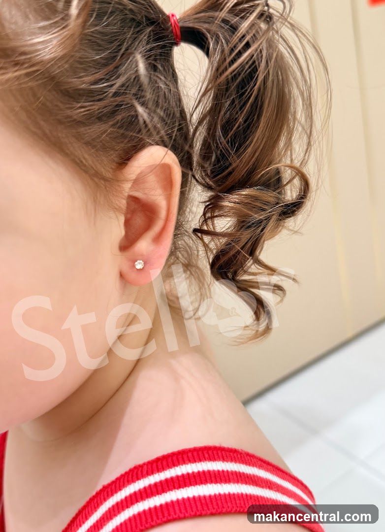 Child Wearing Diamond Stud Earrings