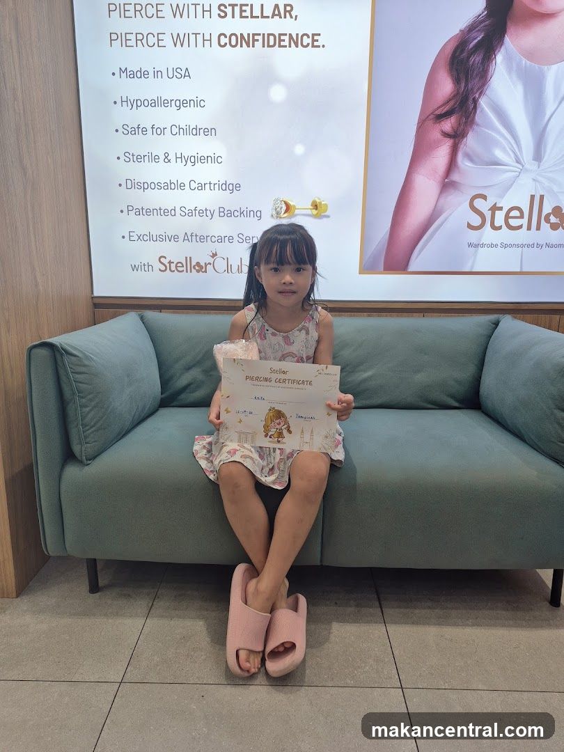 Girl holding a piercing certificate
