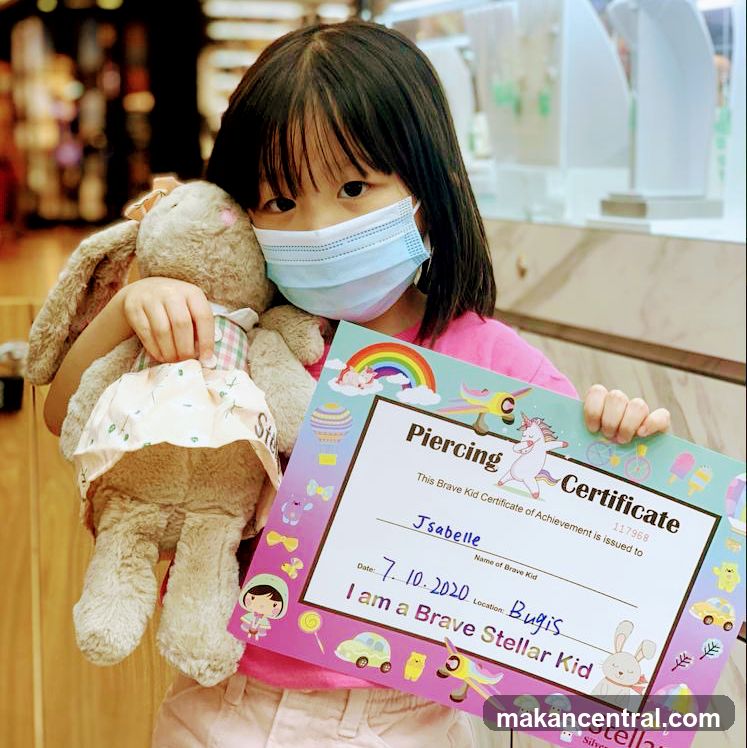Girl with a "Brave Kid" Certificate