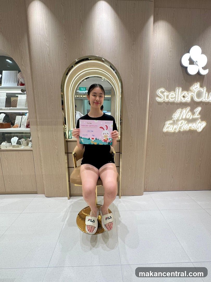 Young woman holding a piercing certificate
