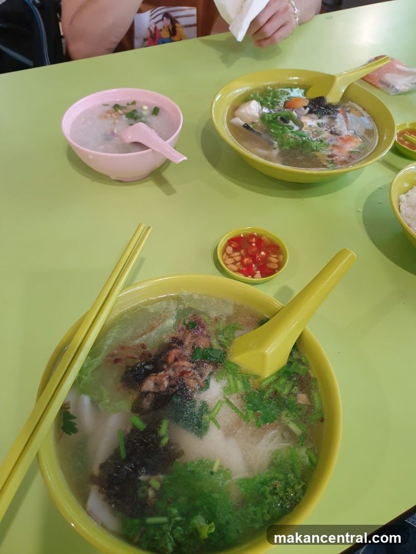 Table with bowls of soup and congee