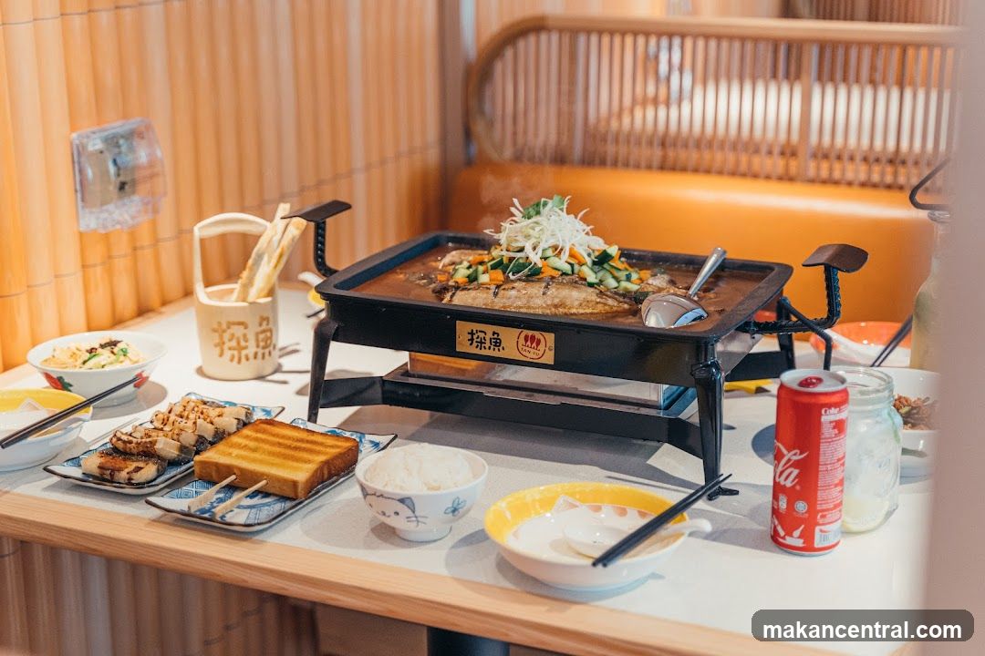 Table with Grilled Fish and Sides