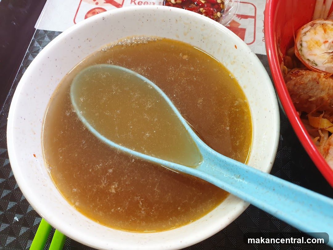 Bowl of Broth with Spoon