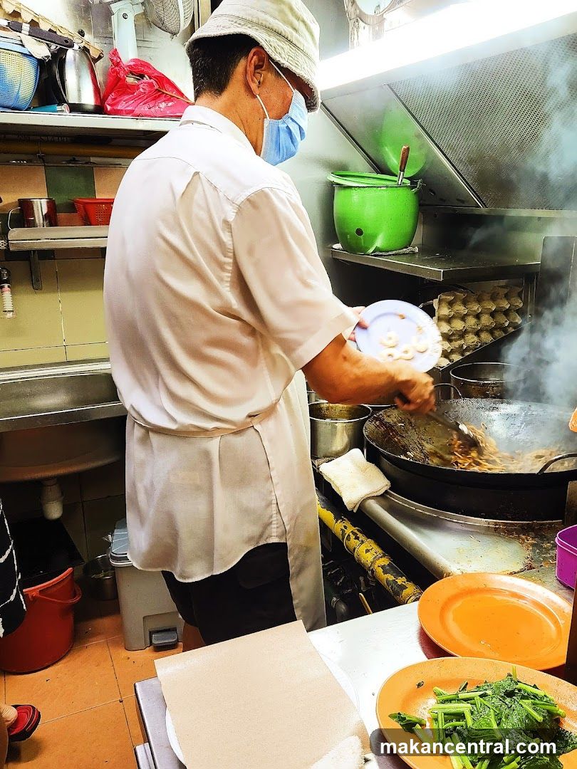 Cook preparing food in a kitchen