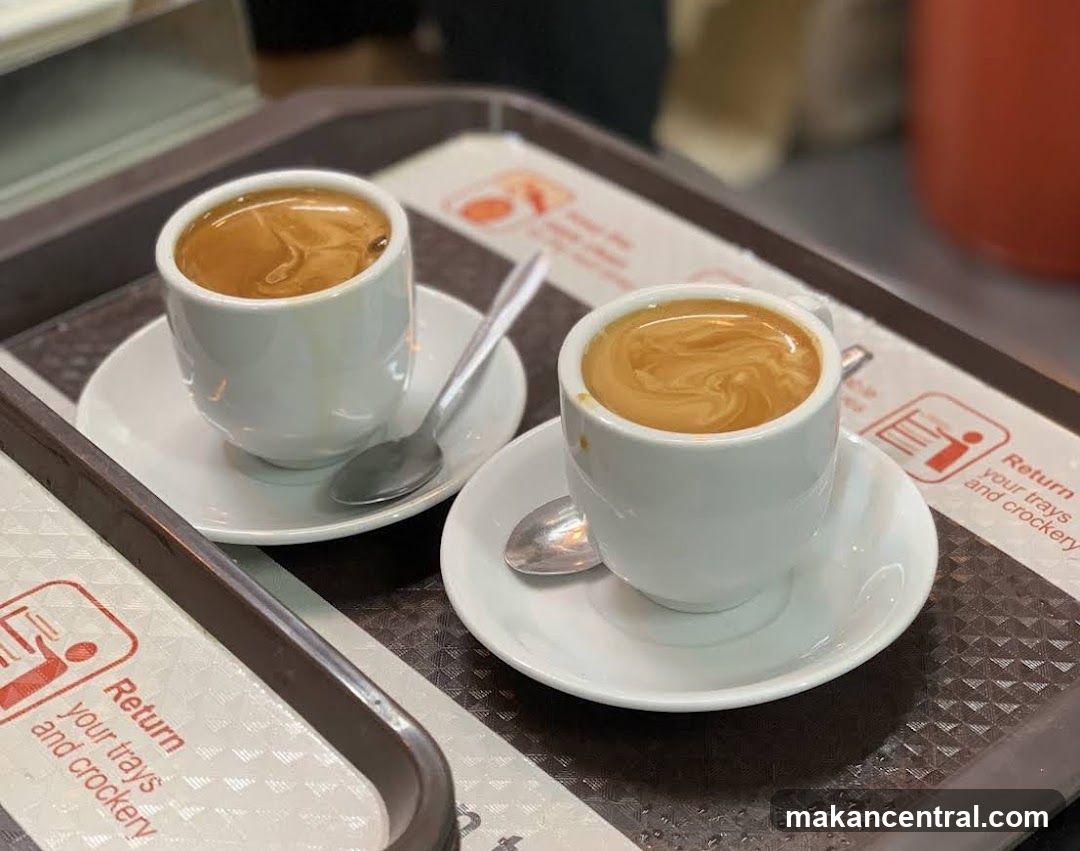 Two cups of coffee on a tray