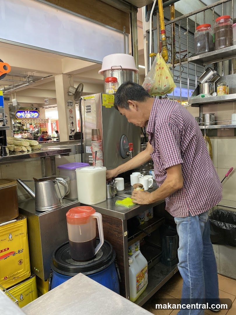 Man preparing drinks at a stall