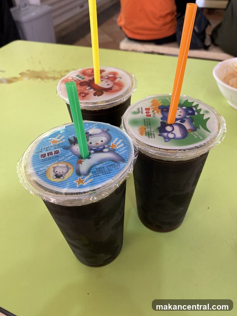 Three drinks with cartoon lids