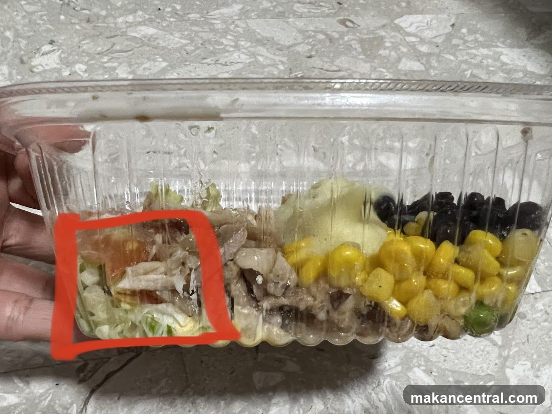 Salad in a clear plastic container