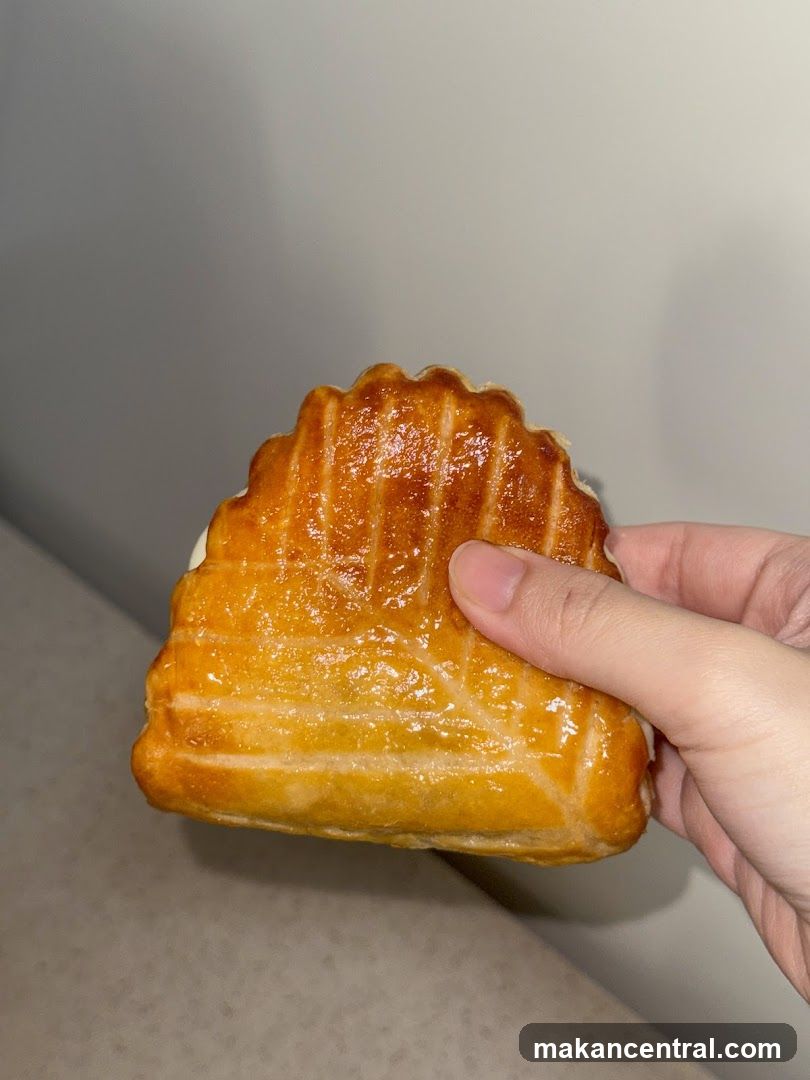 Hand Holding a Pastry
