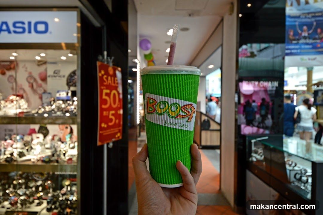 Hand holding a Boost Juice cup