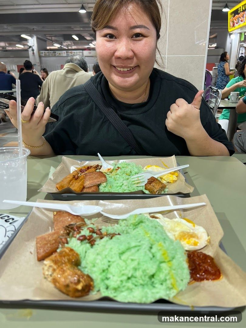 Woman giving a thumbs up with food