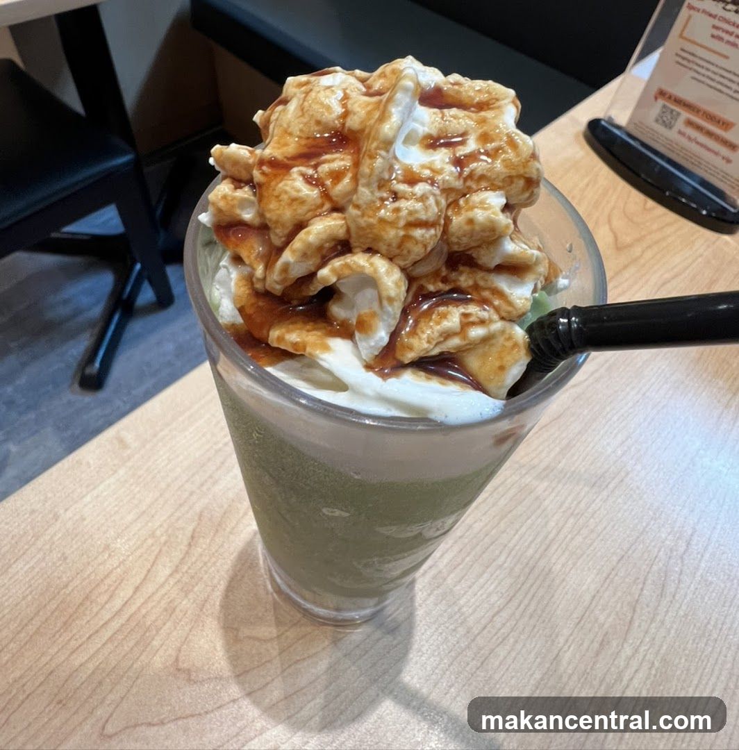 Green Tea Frappe with Whipped Cream and Caramel Drizzle