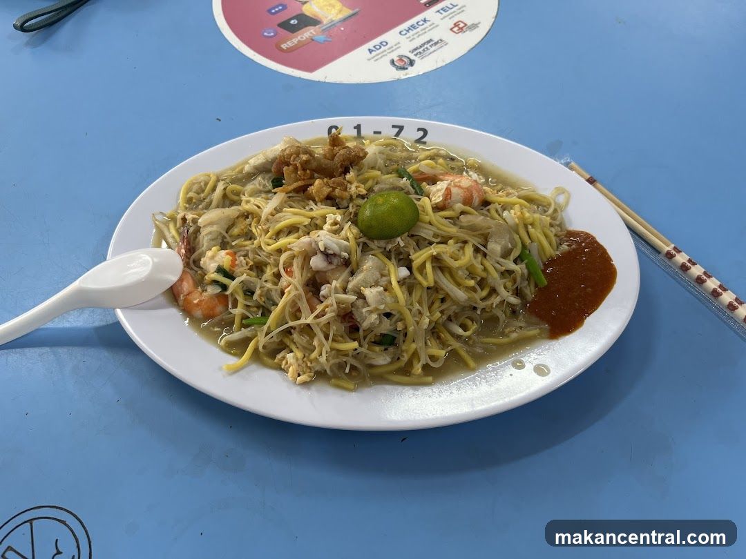 Plate of Hokkien Mee with Chili Sauce and Lime