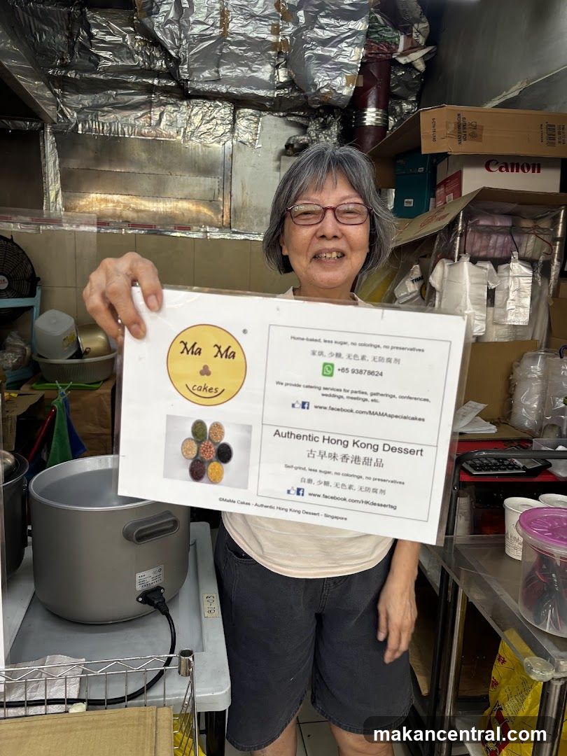 Woman holding a flyer for Ma Ma Cakes
