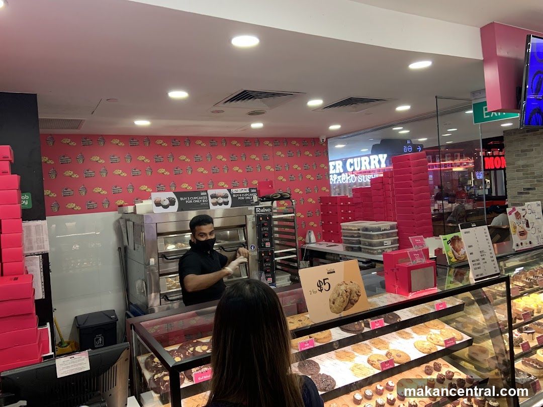 Bakery Counter with Staff and Pastries