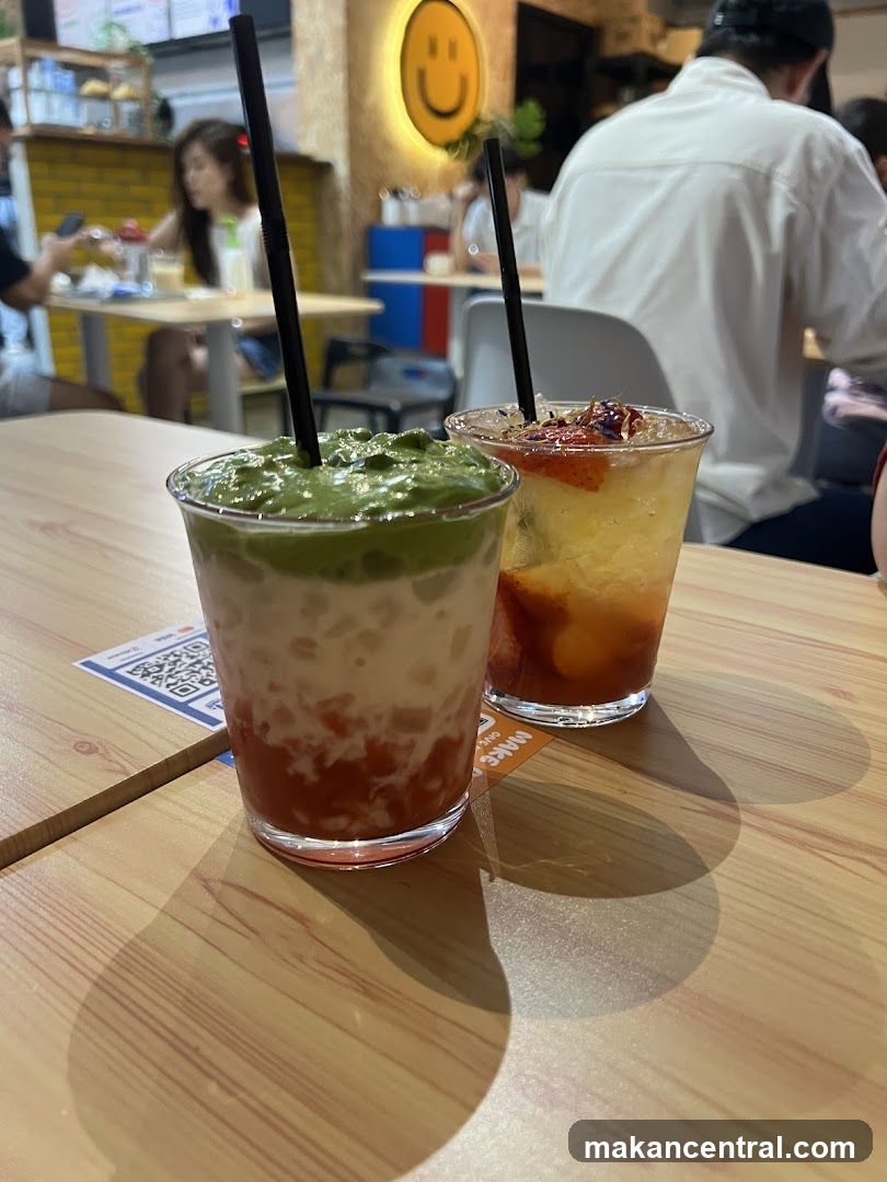 Two colorful drinks on a wooden table