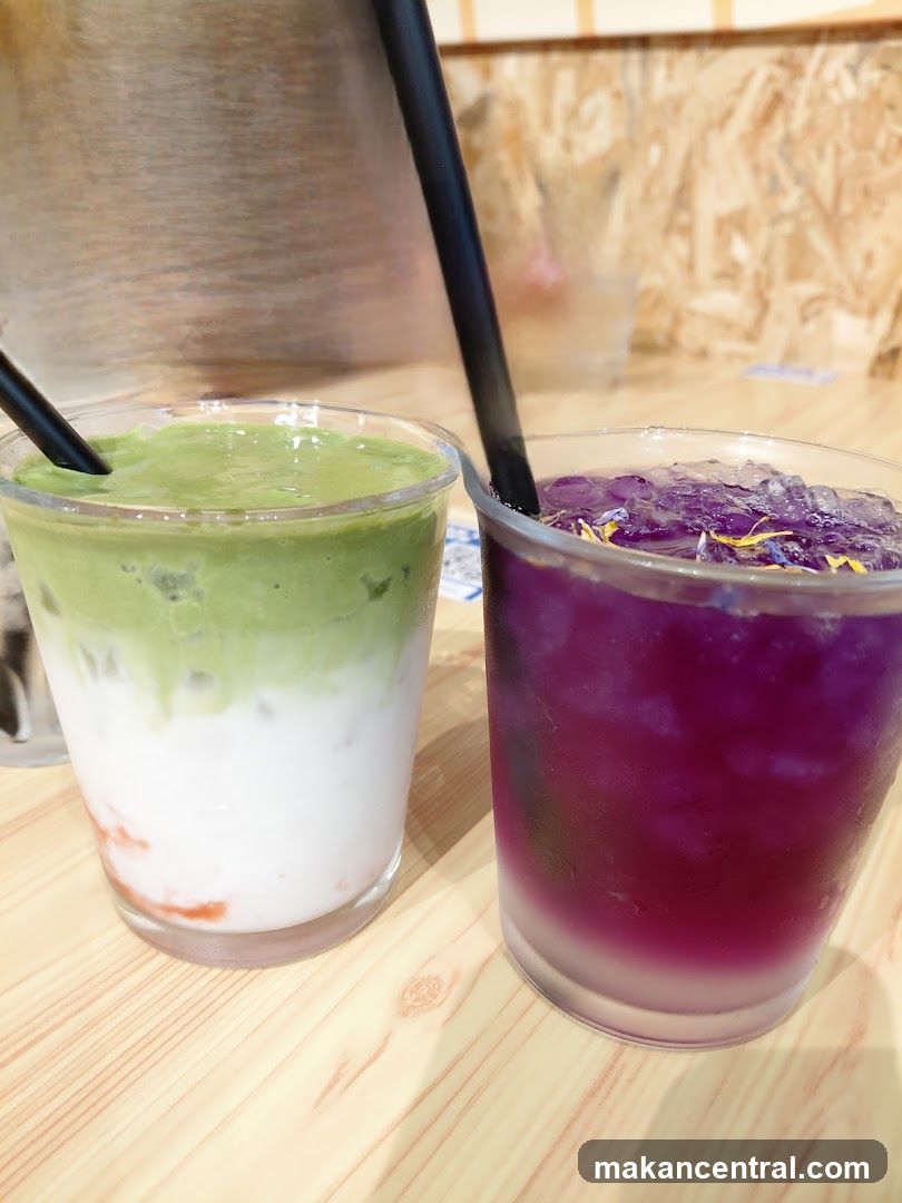 Two colorful drinks on a wooden table