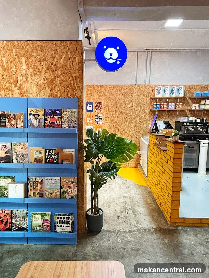 Interior of a cafe with bookshelves and a counter