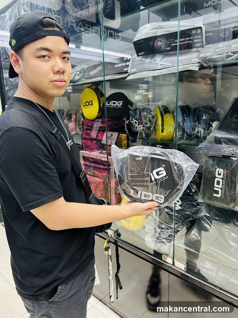 Man holding UDG product in store