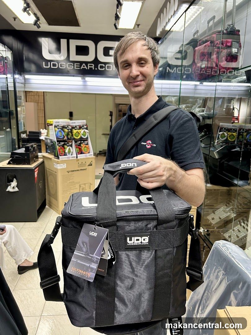 Man holding a UDG bag