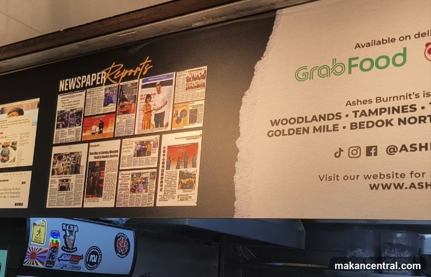 Newspaper Clippings and GrabFood Advertisement