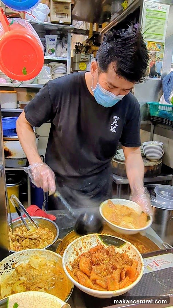 Food Stall Vendor Preparing Meal