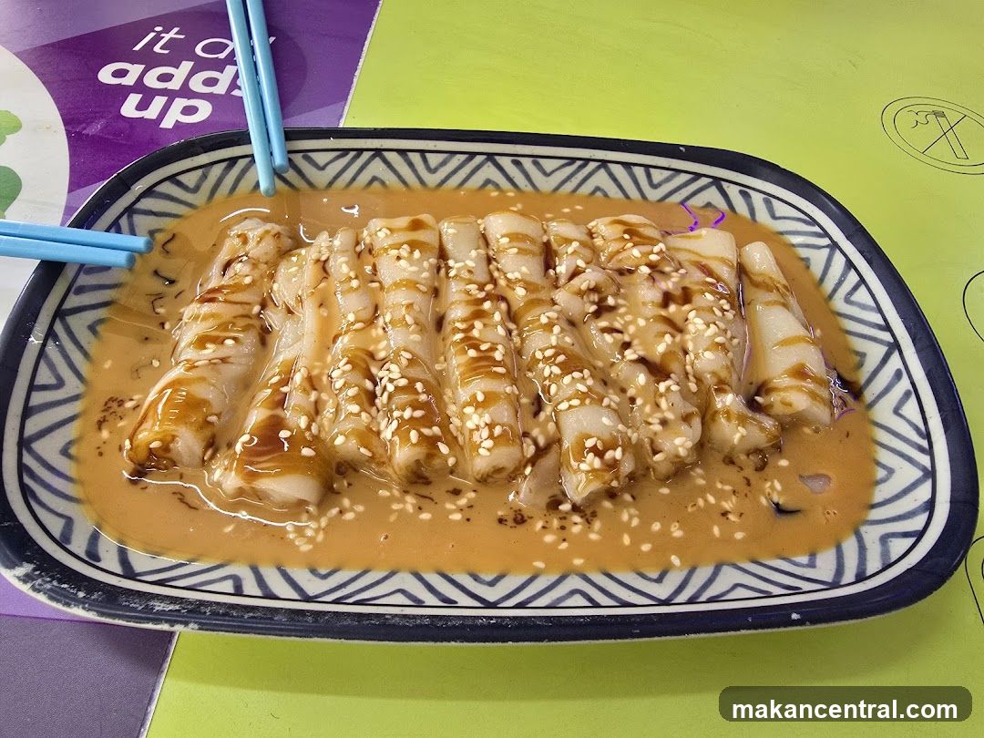 Rolled Rice Noodles with Sauce and Sesame Seeds