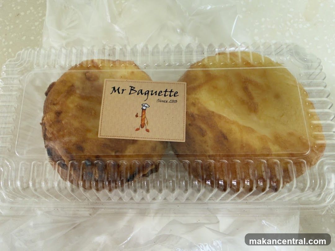 Two pastries in a plastic container