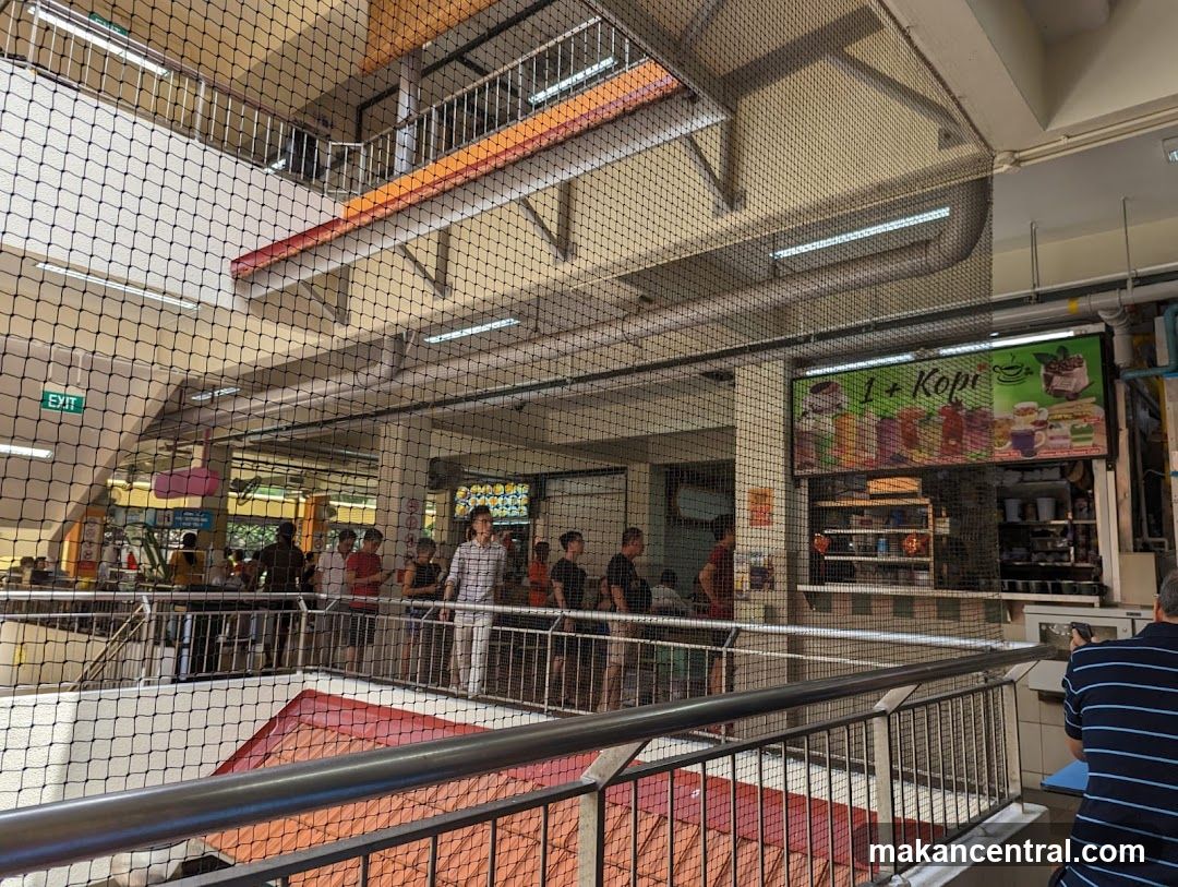 Food court interior with people queuing