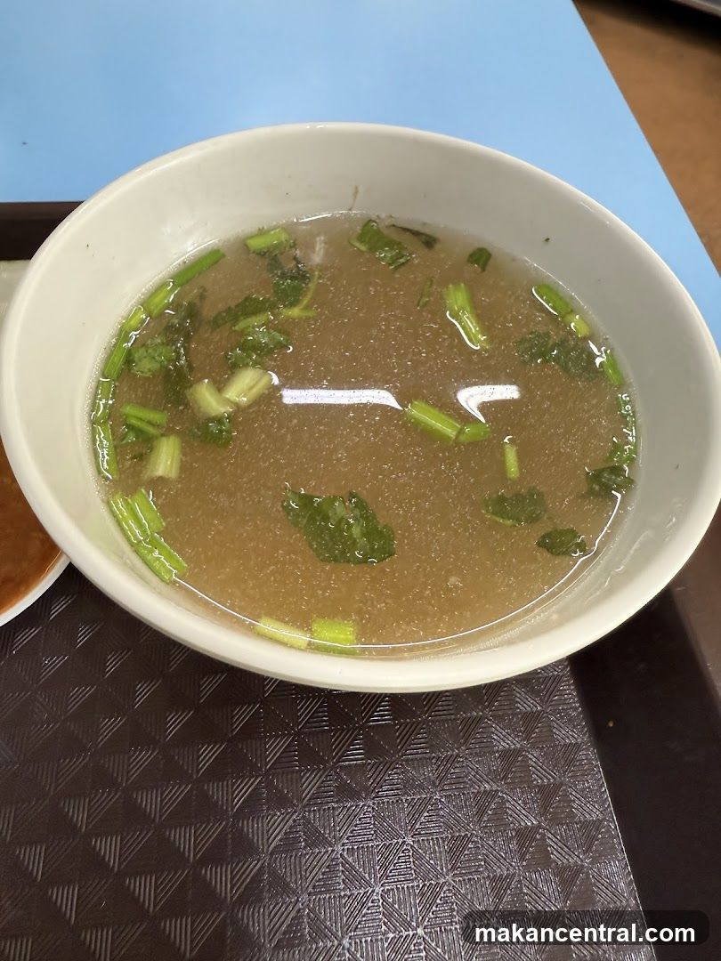Bowl of Broth with Garnish