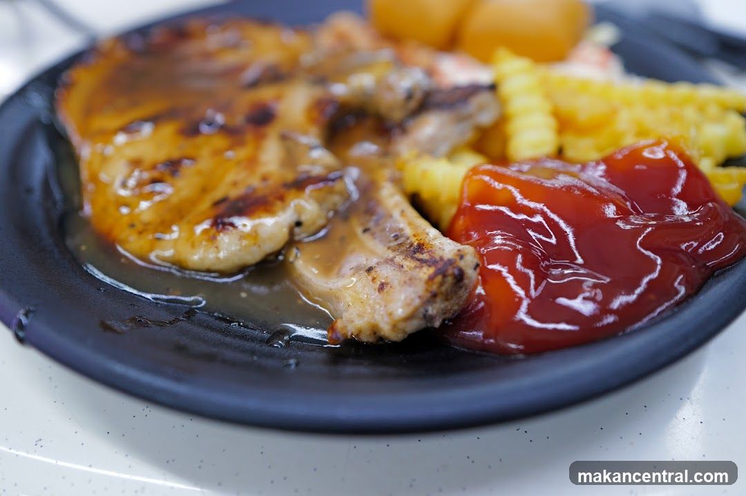 Pork Chop with Fries and Ketchup