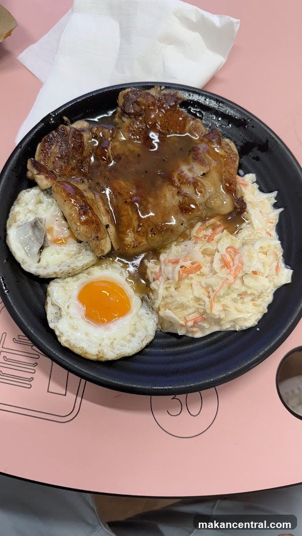 Chicken Chop with Fried Eggs and Coleslaw