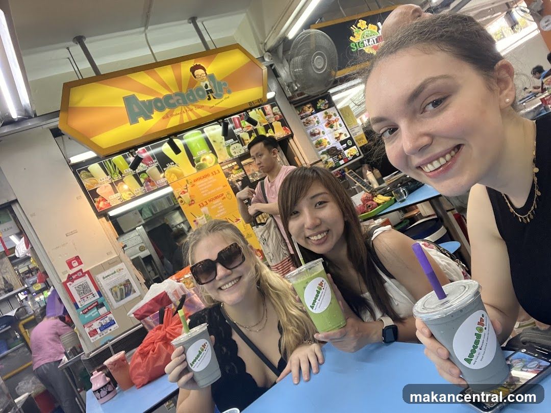 People with drinks at a food stall