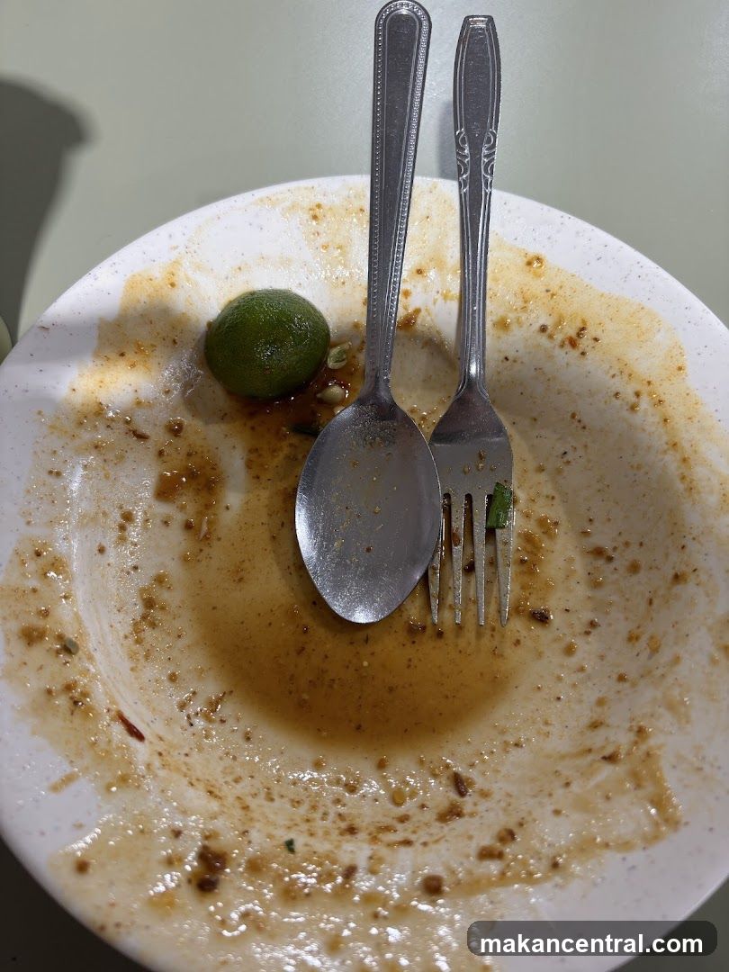 Dirty Plate with Lime and Utensils