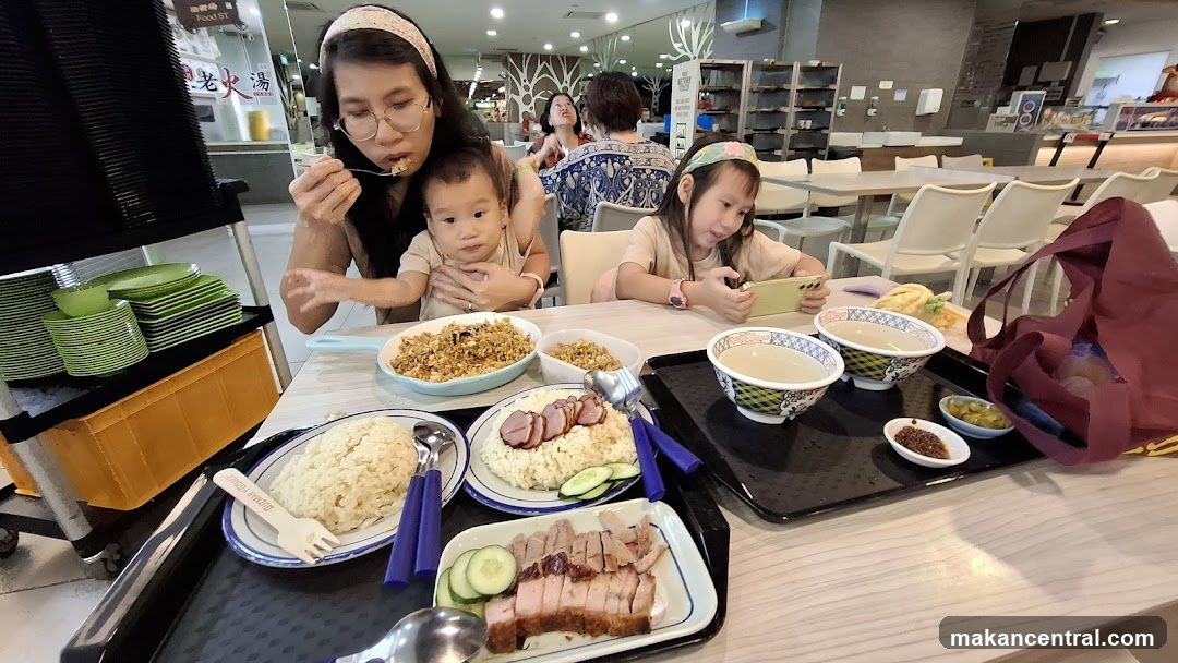 Family enjoying a meal at a food court