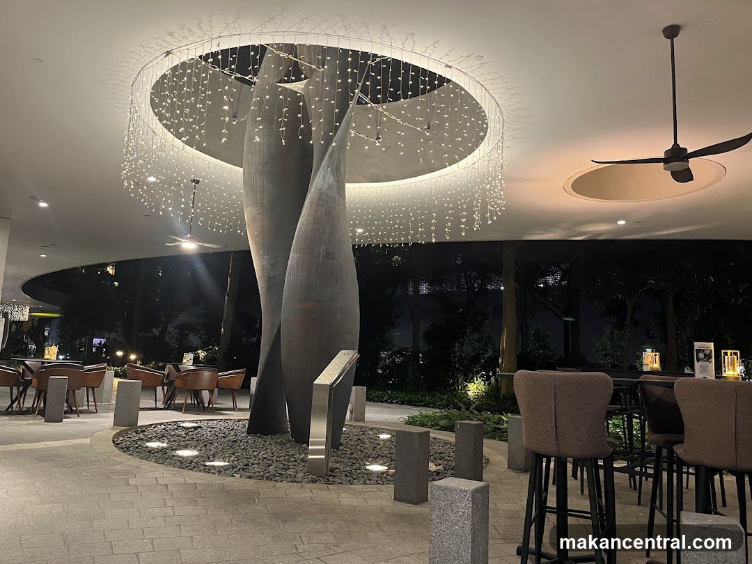 Outdoor Seating Area with Modern Sculpture and Lighting