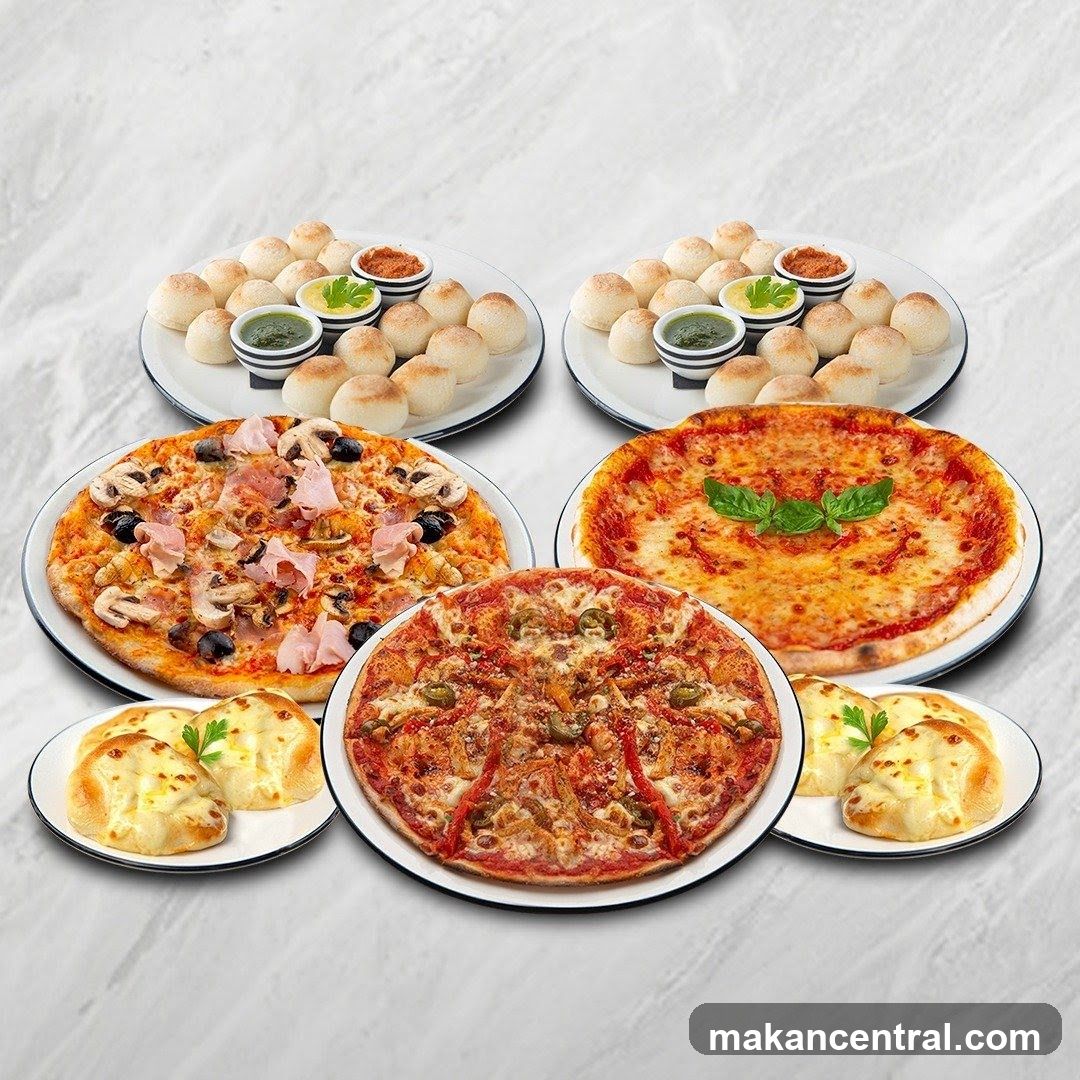 Assortment of Pizzas and Bread Rolls