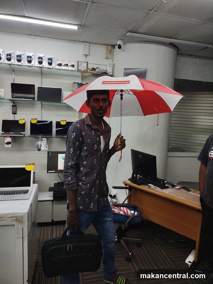 Man holding an umbrella indoors