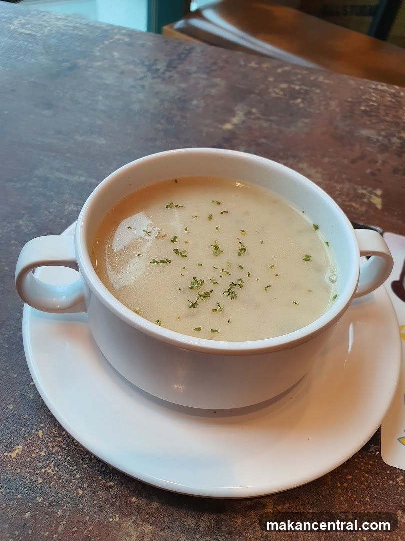 Creamy Soup with Parsley Garnish