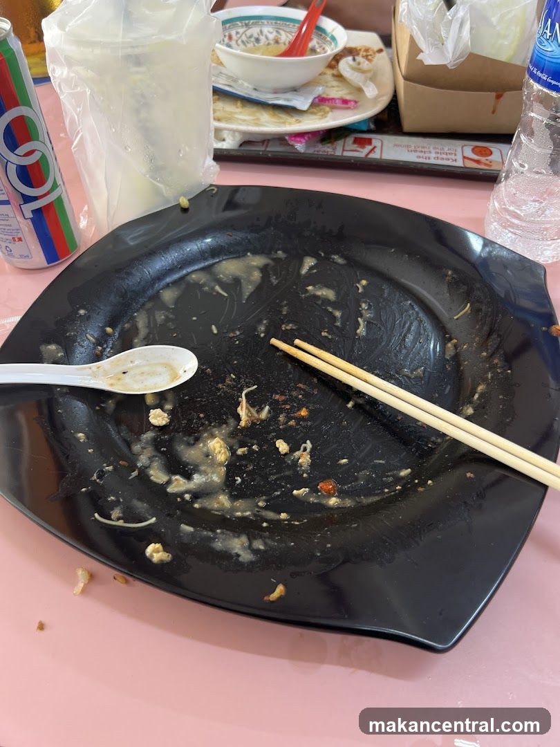 Dirty Plate with Chopsticks and Drinks