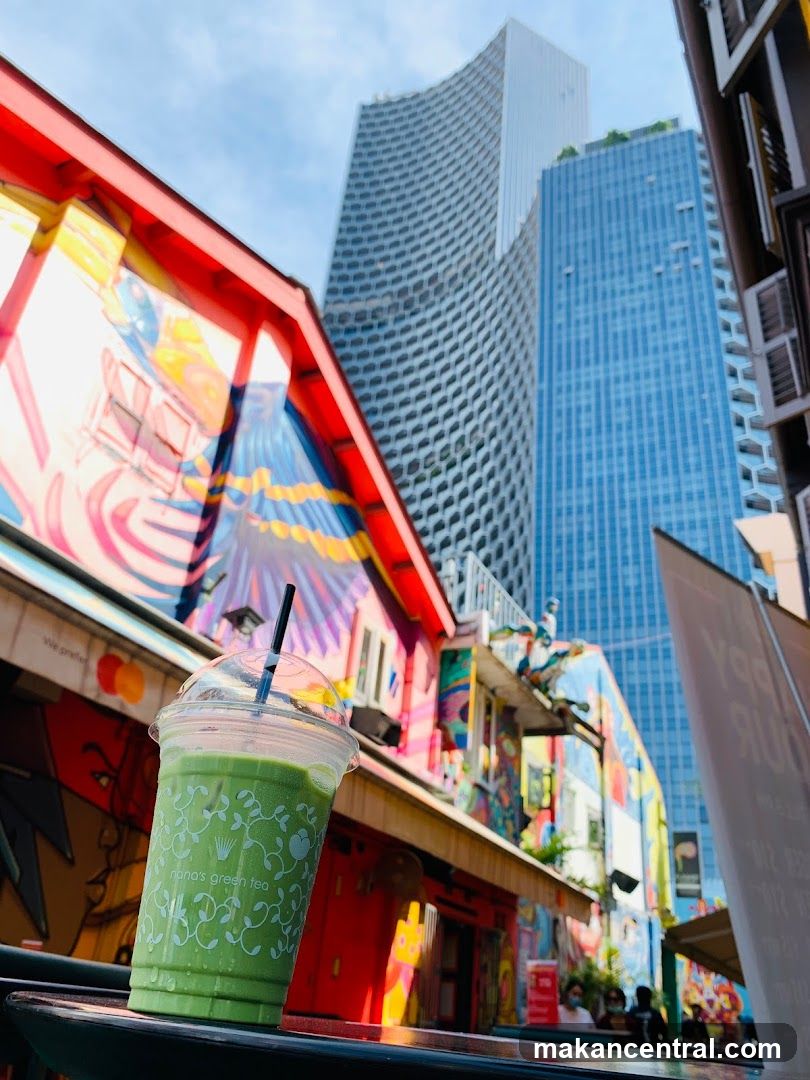 Green Tea Drink with Colorful Buildings