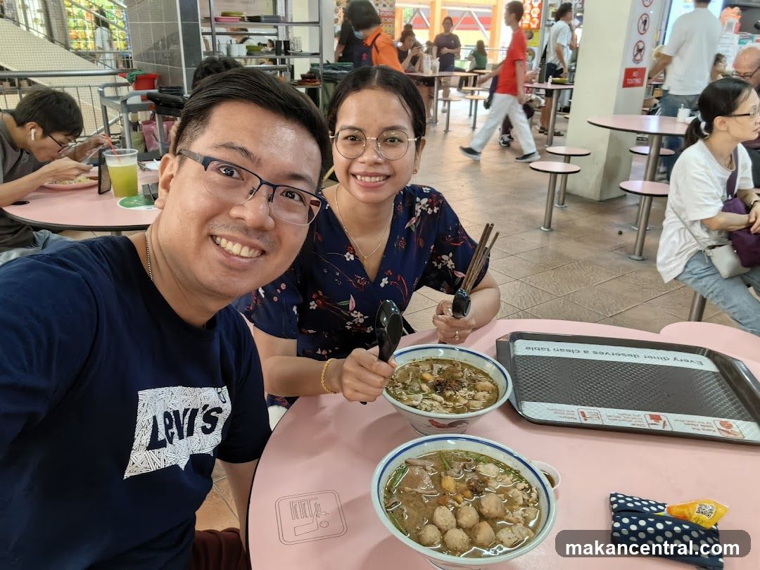 Couple enjoying a meal at a food court