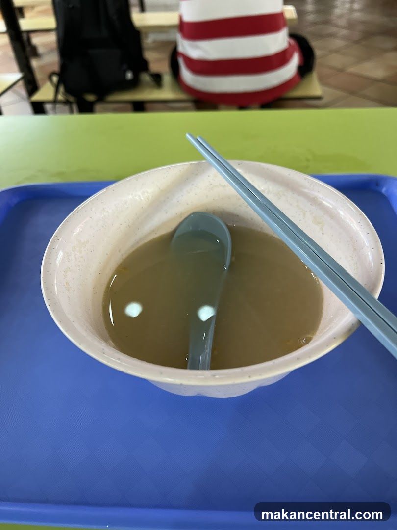 Bowl of Soup with Chopsticks
